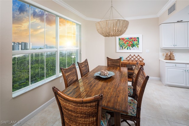 tiled dining space with crown molding and an inviting chandelier