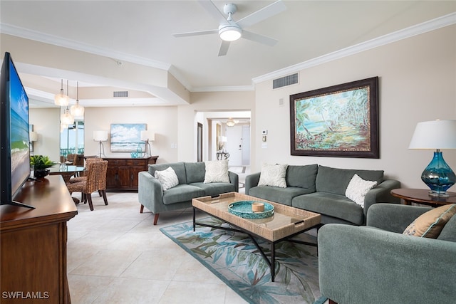 living room with crown molding, light tile patterned floors, and ceiling fan