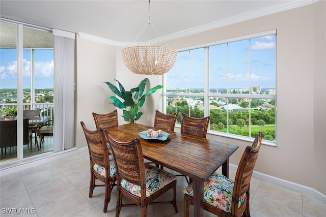 dining room with a notable chandelier, light tile patterned flooring, and crown molding