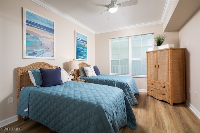 bedroom featuring ornamental molding, hardwood / wood-style floors, and ceiling fan