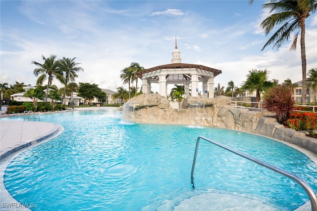 view of swimming pool featuring pool water feature