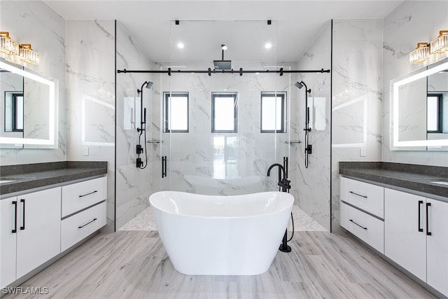 bathroom featuring hardwood / wood-style floors, separate shower and tub, and a wealth of natural light