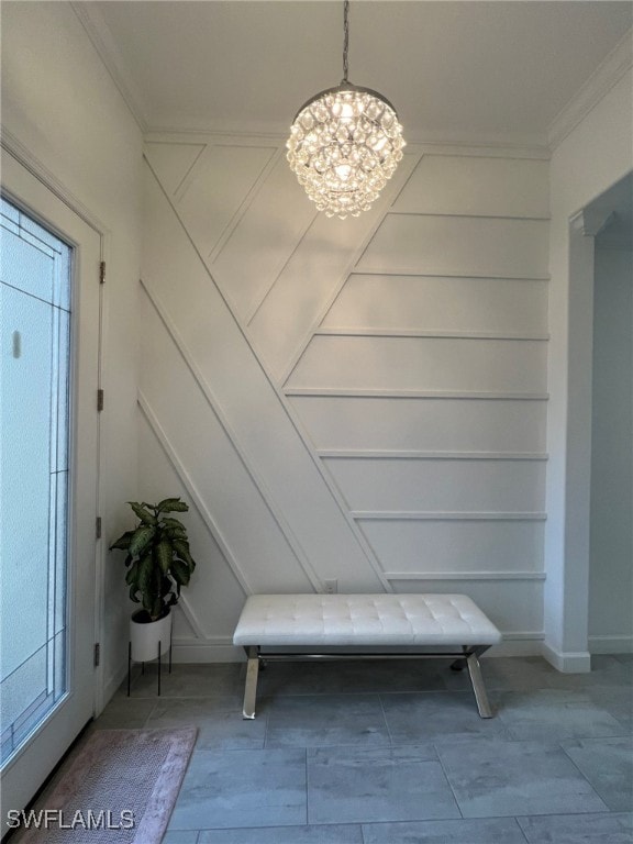 interior space featuring a notable chandelier and crown molding