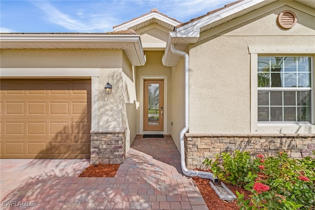 property entrance with a garage