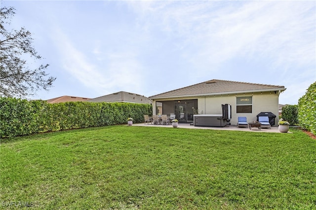 rear view of house with an outdoor living space, a patio, and a yard