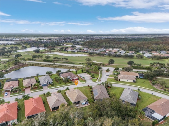 drone / aerial view with a water view