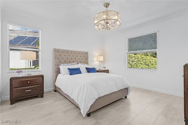 bedroom with multiple windows, crown molding, and an inviting chandelier