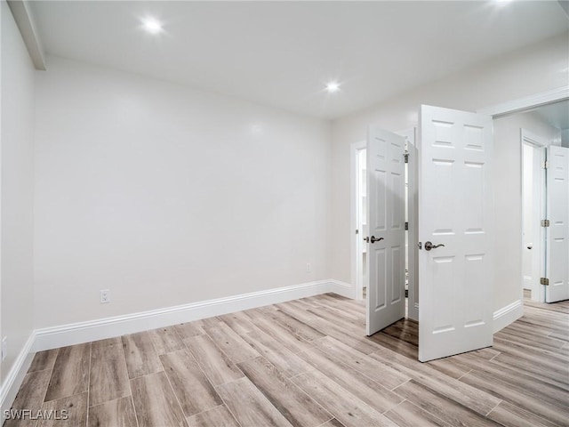 unfurnished room featuring light hardwood / wood-style flooring