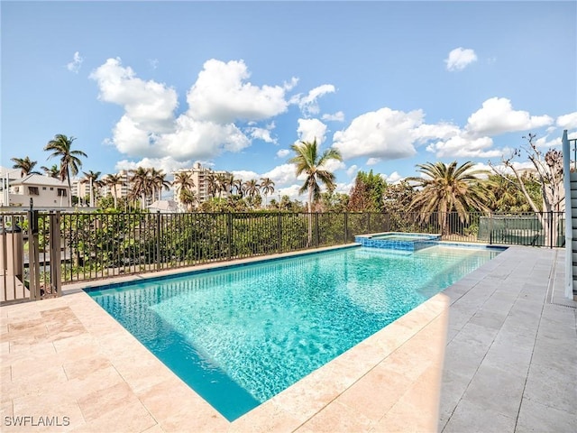 view of pool featuring an in ground hot tub and a patio area