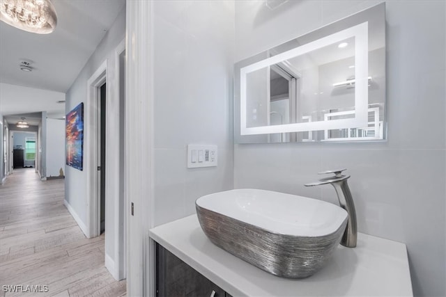 bathroom featuring vanity and hardwood / wood-style floors