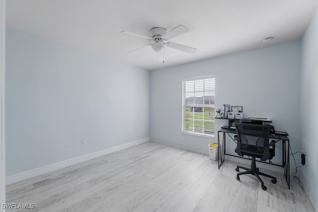 office area with light hardwood / wood-style floors and ceiling fan