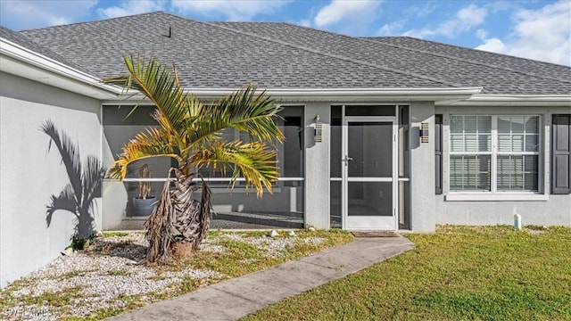 property entrance featuring a yard