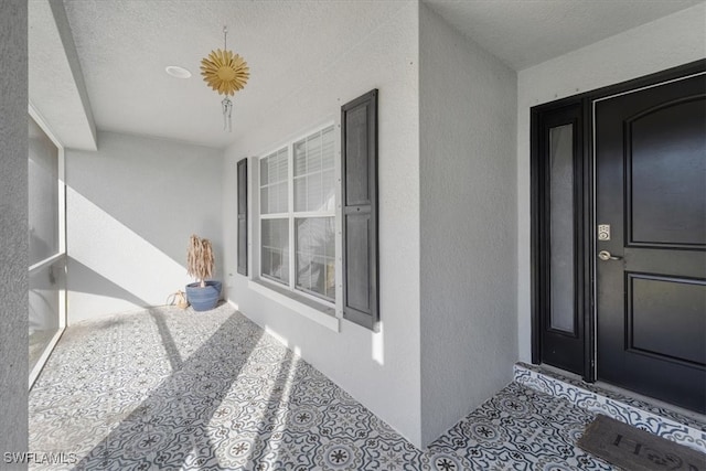 doorway to property featuring covered porch