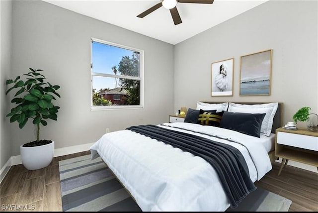 bedroom featuring dark wood-type flooring and ceiling fan