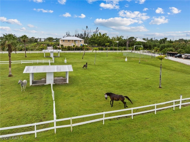 surrounding community with a lawn and a rural view