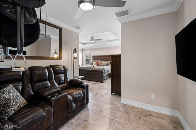 cinema room with crown molding, ceiling fan, and light tile patterned floors