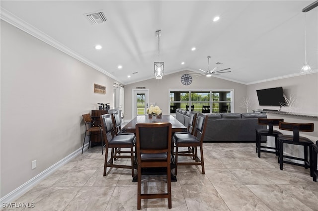 dining space with ornamental molding, ceiling fan, and vaulted ceiling