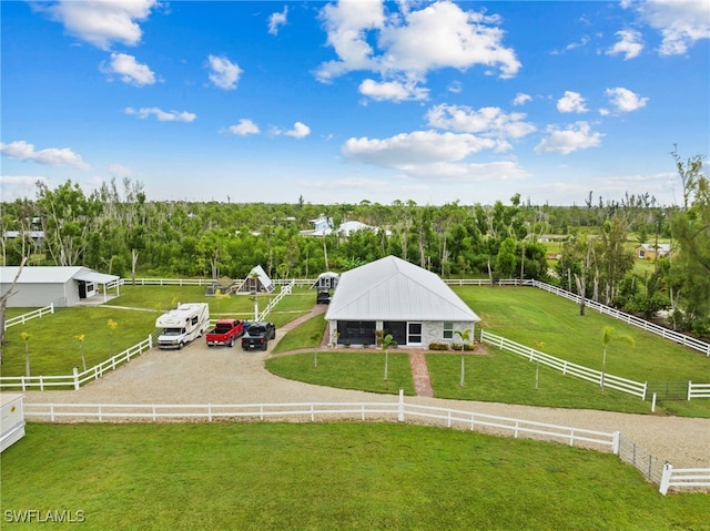 birds eye view of property with a rural view