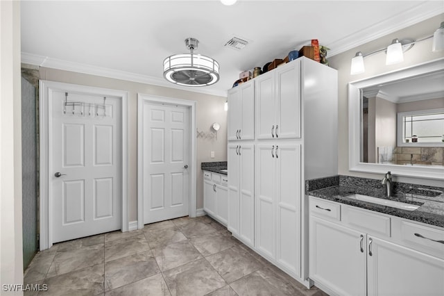 bathroom with vanity and crown molding