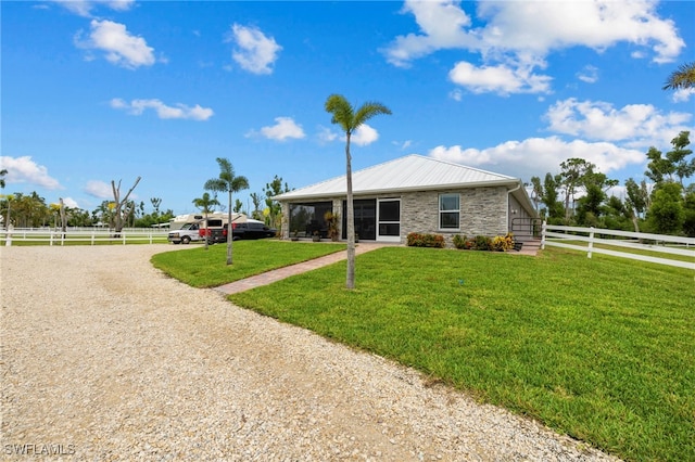 ranch-style home with a front lawn