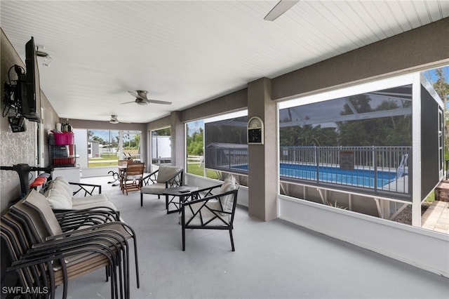 sunroom / solarium with ceiling fan