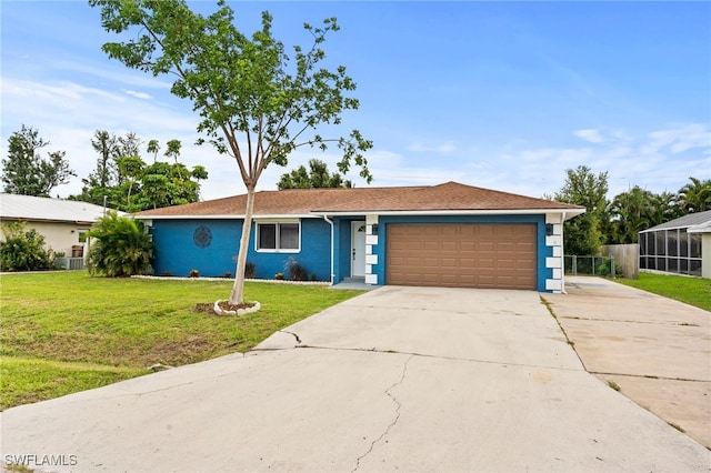 single story home with a garage and a front lawn