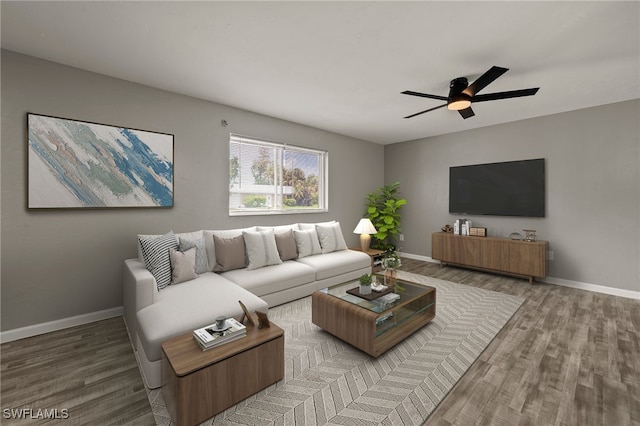 living room featuring ceiling fan and wood-type flooring