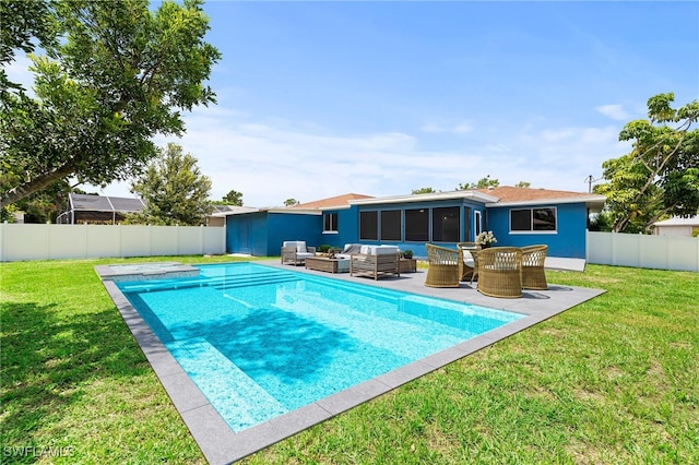 view of swimming pool featuring a patio area, an outdoor hangout area, and a lawn