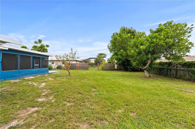 view of yard with a sunroom