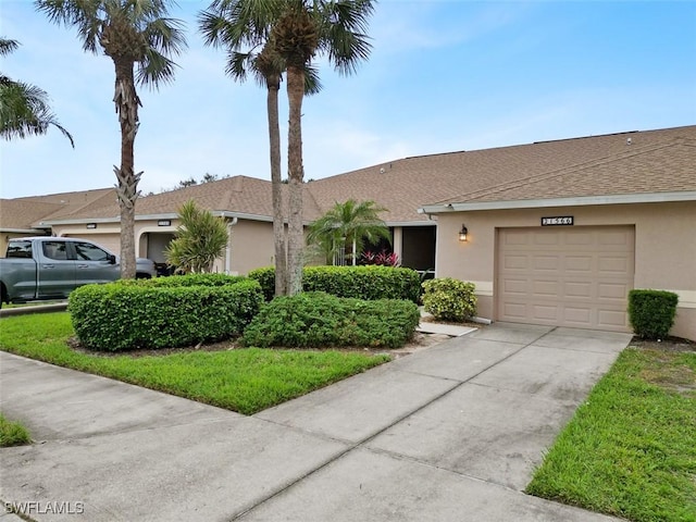 21566 Portrush Run, Estero, FL 33928 - ranch-style house featuring stucco siding, driveway, a shingled roof, and a garage