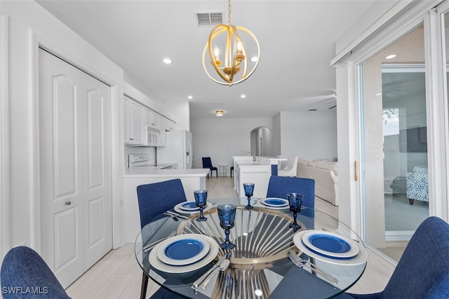 dining area featuring a notable chandelier