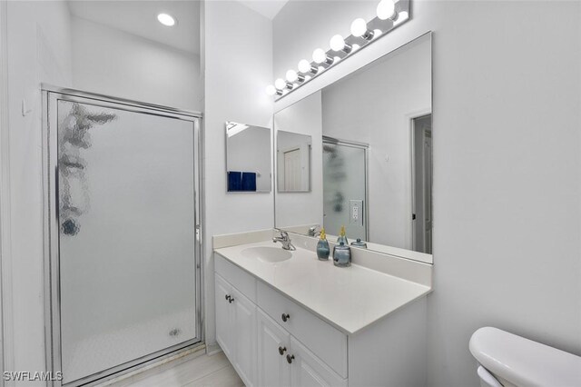 21566 Portrush Run, Estero, FL 33928 - full bath with vanity, a shower stall, toilet, and recessed lighting