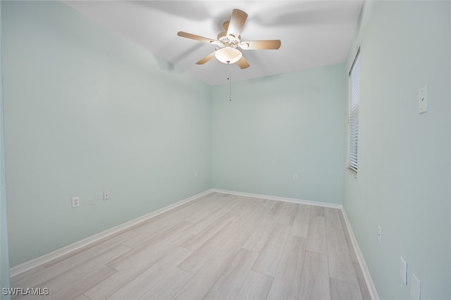 spare room with ceiling fan and light wood-type flooring