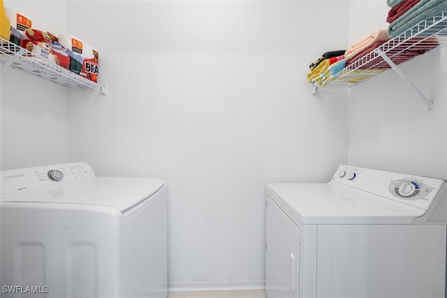 laundry room featuring washing machine and dryer