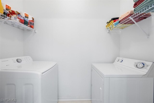 21566 Portrush Run, Estero, FL 33928 - laundry room with washer and clothes dryer