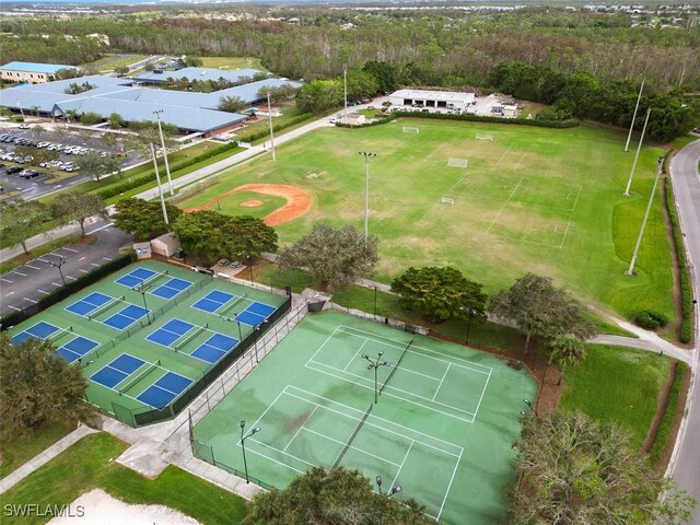 21566 Portrush Run, Estero, FL 33928 - drone / aerial view of a large body of water and a forest