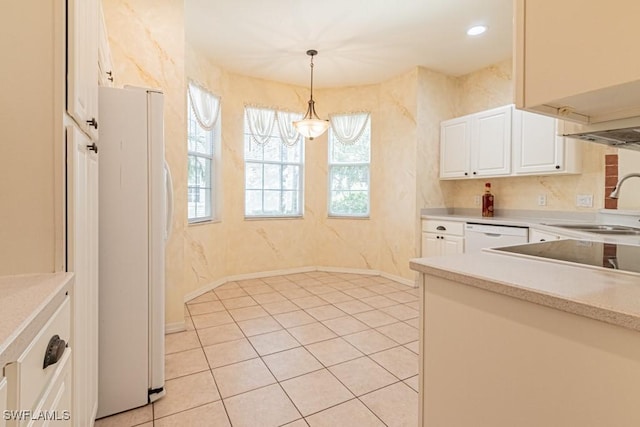 kitchen with a notable chandelier, white appliances, white cabinets, sink, and decorative light fixtures