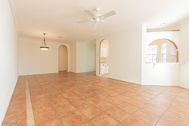 unfurnished room with ceiling fan, light tile patterned flooring, and crown molding