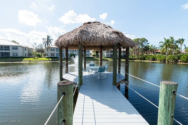 dock area with a gazebo and a water view