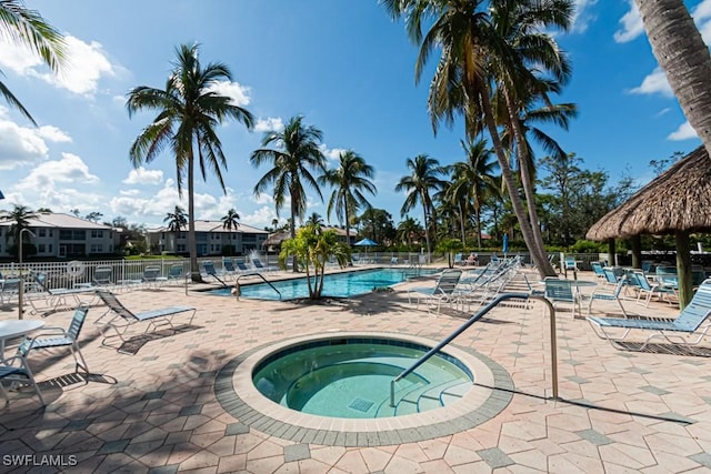 view of pool with a gazebo, a patio, and a hot tub