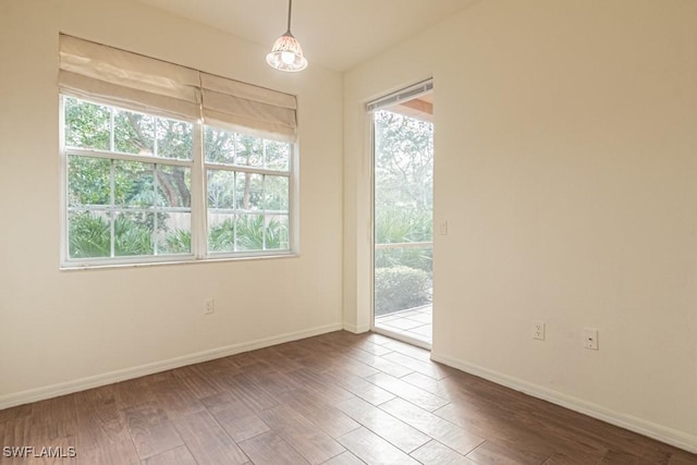 spare room with hardwood / wood-style flooring