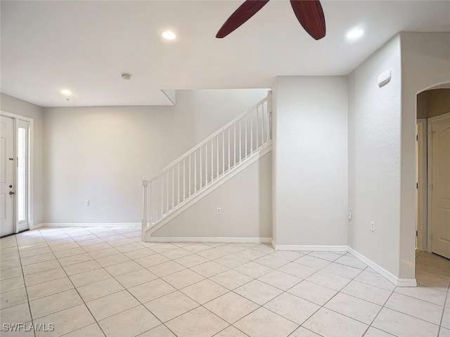 interior space with ceiling fan