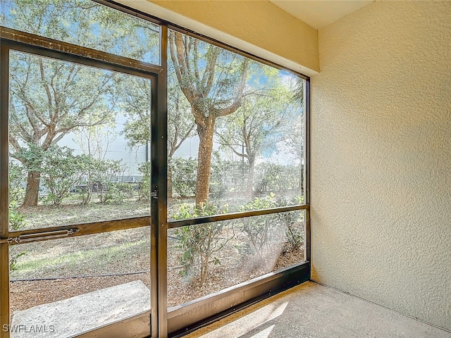 unfurnished sunroom with a healthy amount of sunlight