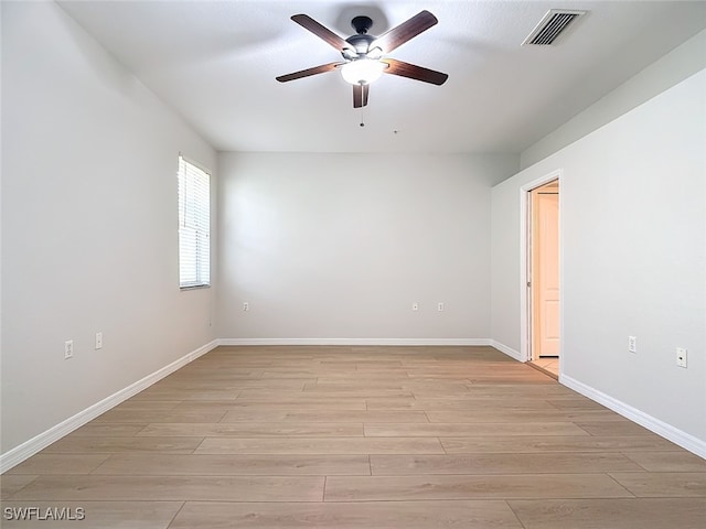 spare room with ceiling fan and light hardwood / wood-style flooring