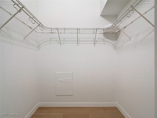 walk in closet featuring hardwood / wood-style floors