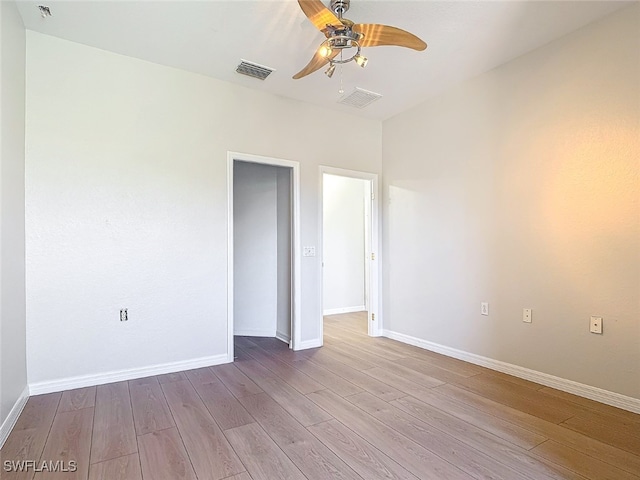 spare room with light hardwood / wood-style flooring and ceiling fan