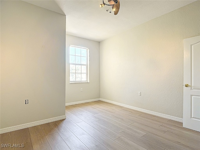 spare room with light wood-type flooring