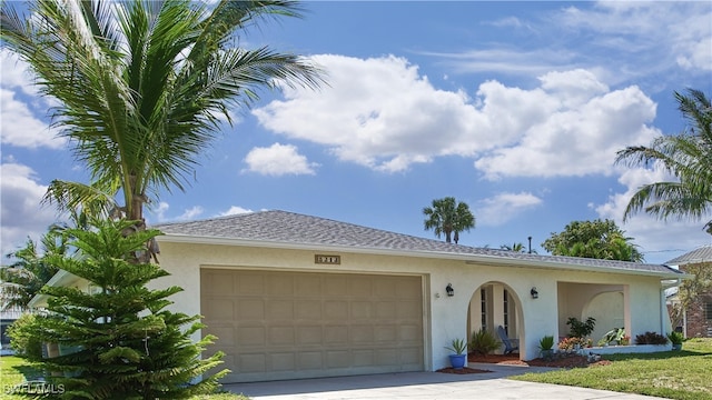 single story home featuring a garage