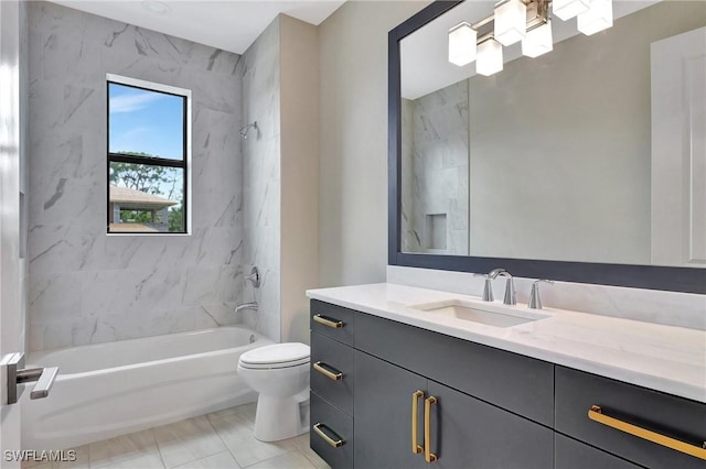 full bathroom featuring tiled shower / bath combo, vanity, and toilet