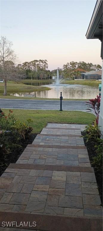 patio terrace at dusk with a water view